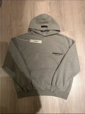 New Essentials Dark Coloured Hoodie with dust Bag